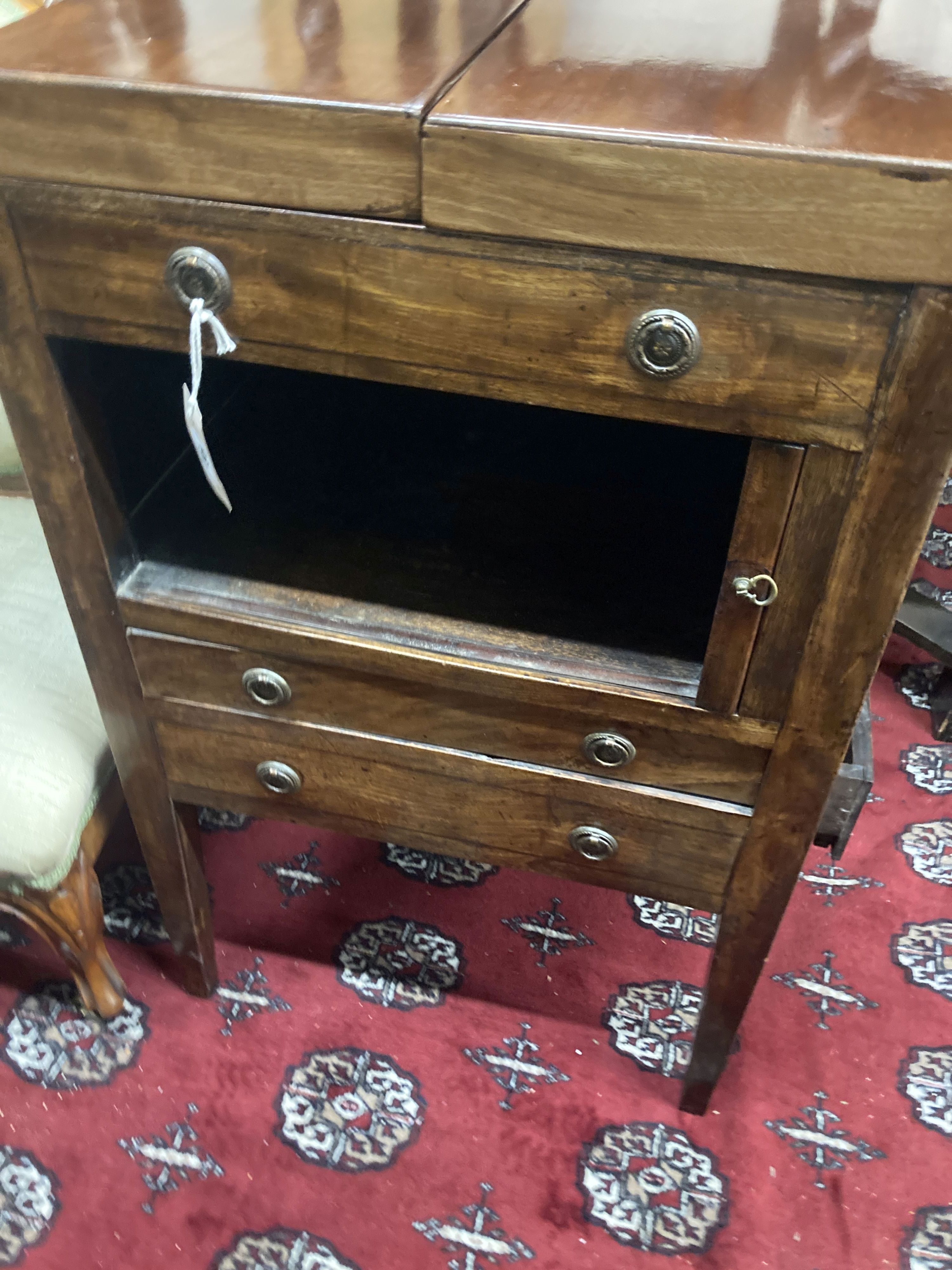 A George III mahogany tambour front enclosed washstand, width 53cm, depth 45cm, height 87cm